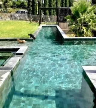 Luxury swimming pool featuring premium balinese tiles supplied by Direct Pool Tiles.